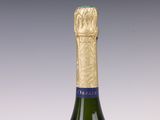 a bottle of wine that is sitting on a table