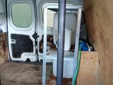 an image of the inside of a van with the door open