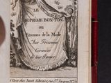an open book with a drawing of a woman holding a curtain