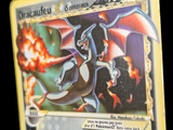 a close up of a pokemon card with a dragon on it