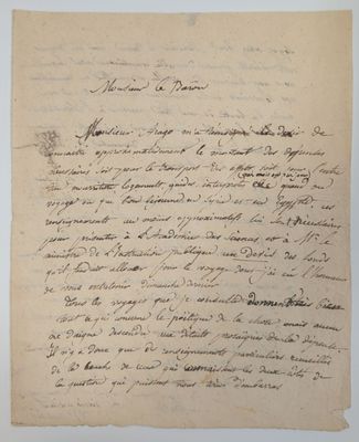 lettre manuscrite écrite à l'encre noire sur une feuille de papier