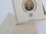 an old photo of a man in a suit and tie on a card
