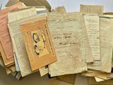 a box full of old papers on a table