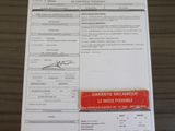a picture of a document with a red tag on it