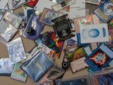 a pile of cards and other items on a table