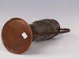 an image of a bronze vase with a lid and a handle