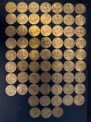 gold coins are arranged in a square pattern on a black surface