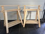 two wooden tables that are standing next to each other