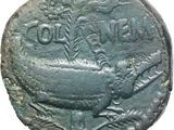 a close up of a coin with a bird on it