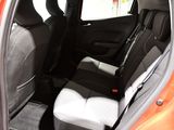 the interior of a car with the door open showing the front seats