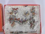 a box with a bunch of toy horses in it