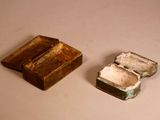 a small box and a small box sitting on a table
