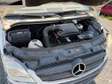 a car with its hood open and the engine in the trunk