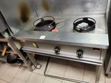 a stove with a pot on top of it in a kitchen