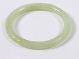 an image of a green bracelet on a white surface