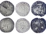 six types différents de pièces d'argent sur fond blanc