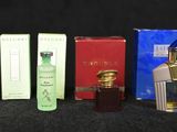 many different types of perfumes on a black surface