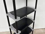 a close up of a black and silver shelf with three shelves