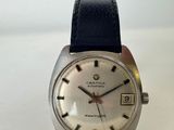 an image of a close up of a wrist watch on a white surface