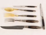 five different types of knives and a knife on a table
