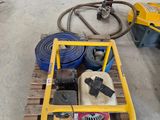a yellow cart with tools on it in a garage