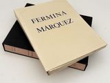 two books stacked on top of each other on a table