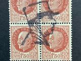 a close up of a stamp with four heads on it