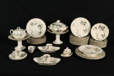 many plates and cups and saucers on the table