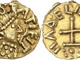 a gold coin with a cross on the front and a cross on the back