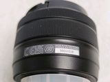 a close up of a camera lens on a white surface