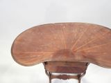 a small wooden table with a fan on top of it