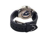 wrist watch with a black rubber band and a silver face