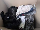a box full of clothes and shoes inside of it