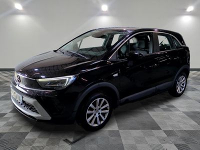 the black suv is parked in a large room with a checkered floor