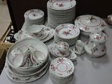 a lot of plates and cups on the table