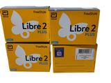 Trois boîtes de Libre 2 Plus sont empilées les unes sur les autres