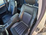 the interior of a car with black leather seats and a steering wheel