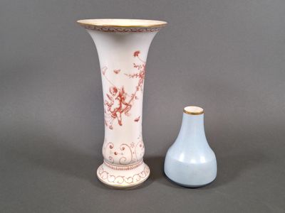 two vases sitting next to each other on a table