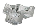 a clear glass object that is on a white surface