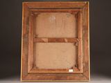 an old wooden picture frame with a piece of paper in it