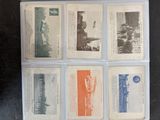 several old postcards of different types and colors are on a table