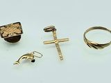 three gold rings and a ring with a cross on it