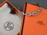 an orange box with a keychain and a silver chain around it