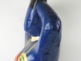a colorful statue of a man with a hat on