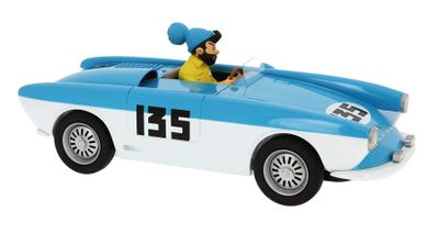 the toy car is blue and white with a man in a yellow shirt