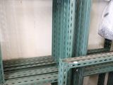 many green shelvings that are stacked on top of each other
