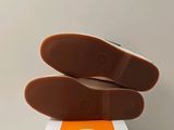 a pair of shoes that are on top of a box