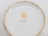 a white plate with a gold rim on it