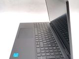 a laptop that is open on a white surface