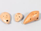 three pieces of wood with holes in the middle of them
